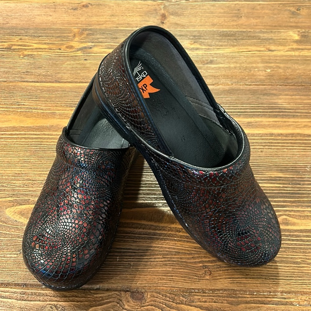Dansko XP metallic red and black embossed snakeskin print clogs